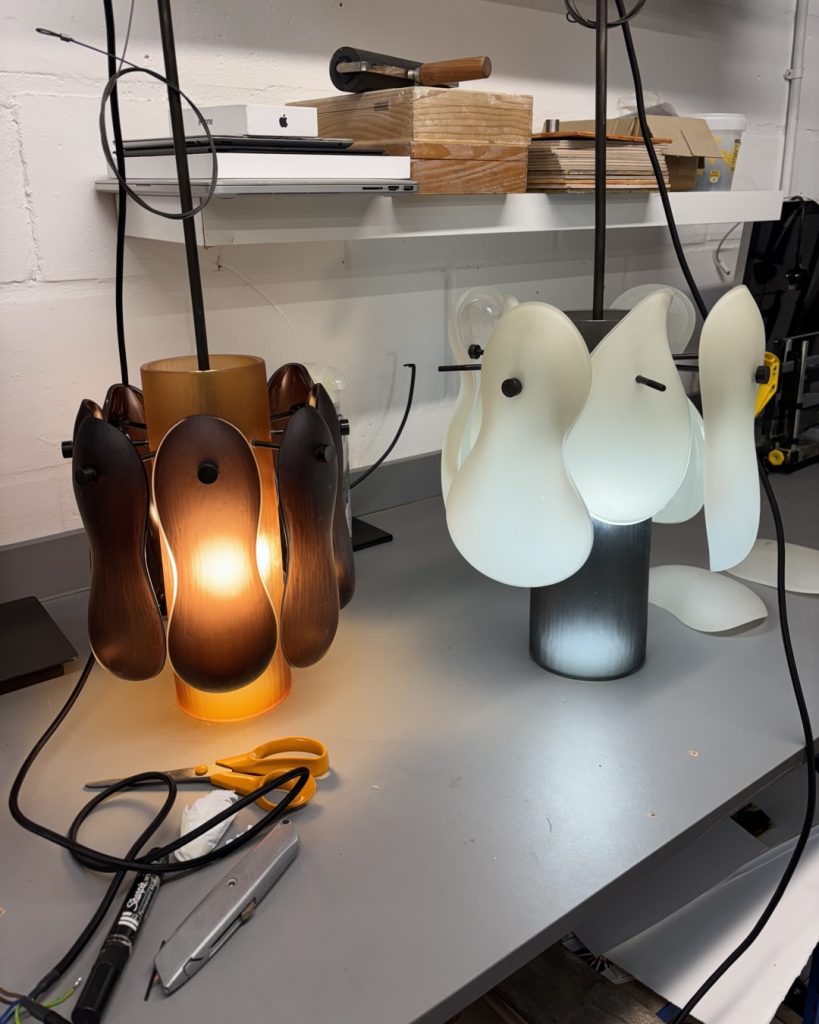 Soft Bean Pendants, A blown cylinder in the centre decorated with blown glass soft bean shape pendants.